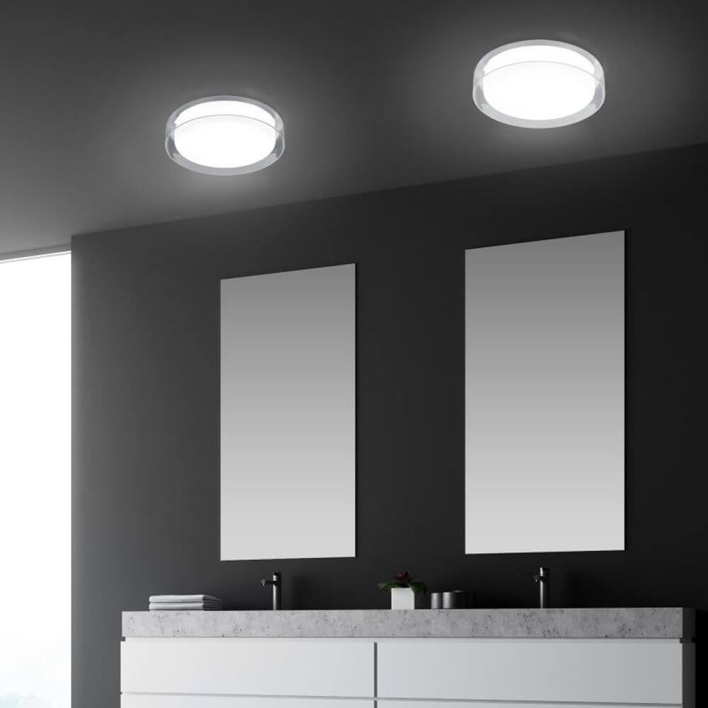LED Badlampe Olvi 1020lm IP44 in modernem Badezimmer-Design mit eleganten Spiegeln.