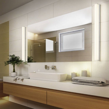 LED Spiegellampe Lado 90cm 1560lm Chrom Warmweiß im modernen Badezimmer mit Spiegel.