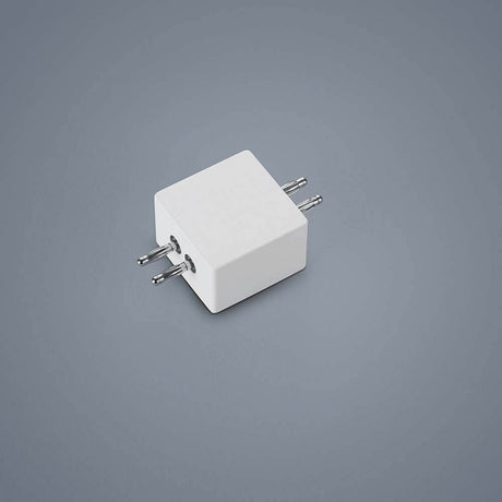 Connecteur linéaire Vigo blanc sur fond gris, utilisation polyvalente dans différents projets.
