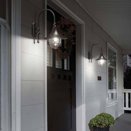 Cima Außen-Wandleuchte IP43 an einer Haustür, elegant und modern, ideal für den Außenbereich.