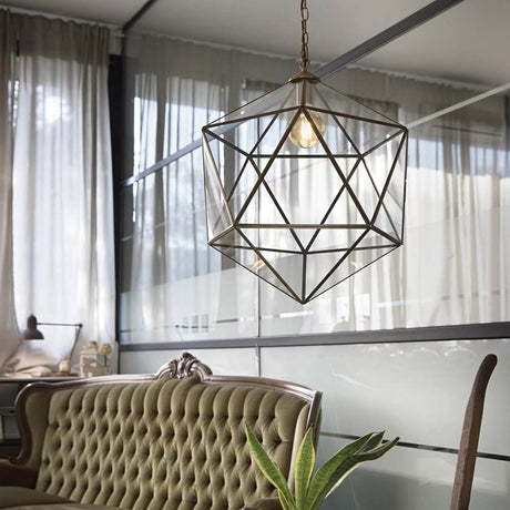 Pendant light Deca Sp1 Gross in a modern interior design above a cozy sofa.
