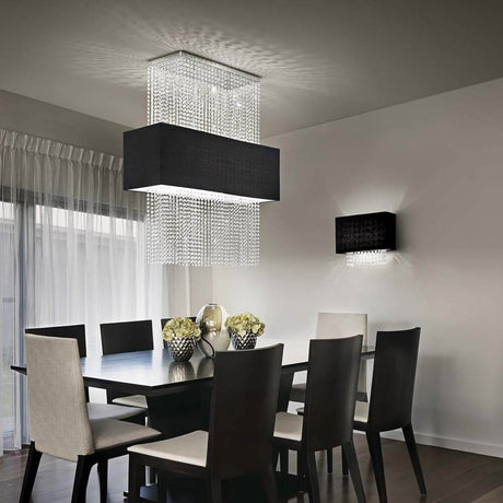 Phoenix Sp5 pendant light in black in a modern dining room with elegant chairs and stylish decorations.