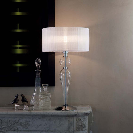 Duchessa Tl1 table lamp on an elegant table with stylish decorations.