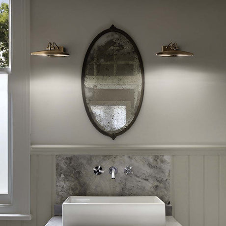 Wall light Mirror-20 Ap2 burnished on a mirror above the washbasin in a modern bathroom.
