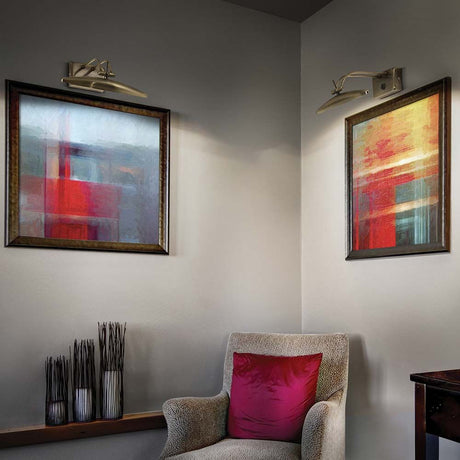 Wall light Mirror-20 Ap2 Ottone above two modern works of art in a cozy living room.