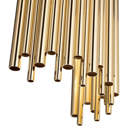 Vegglys Pan 2 lyskilder gullfarget, klar med glinsende gullfargede rør som reflekterer lys.