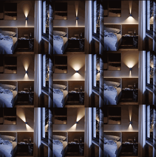 Gemütliches Schlafzimmer mit sanfter Beleuchtung, Bett und Nachttisch, ideal für entspannende Nächte.