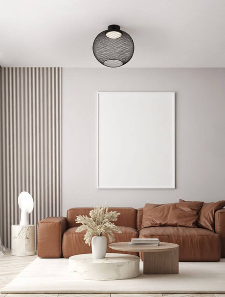 Plafonnier Kinetic LED 3000K noir dans un salon moderne avec intérieur élégant.