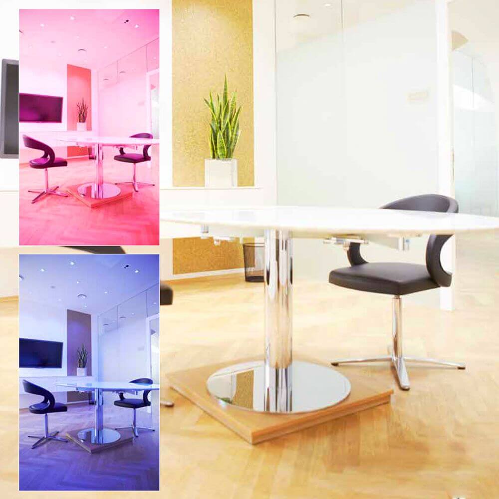 Moderne Büroumgebung mit K-Spot Flat LED Leuchte in verschiedenen Farbtemperaturen und stilvollem Tisch-Design.