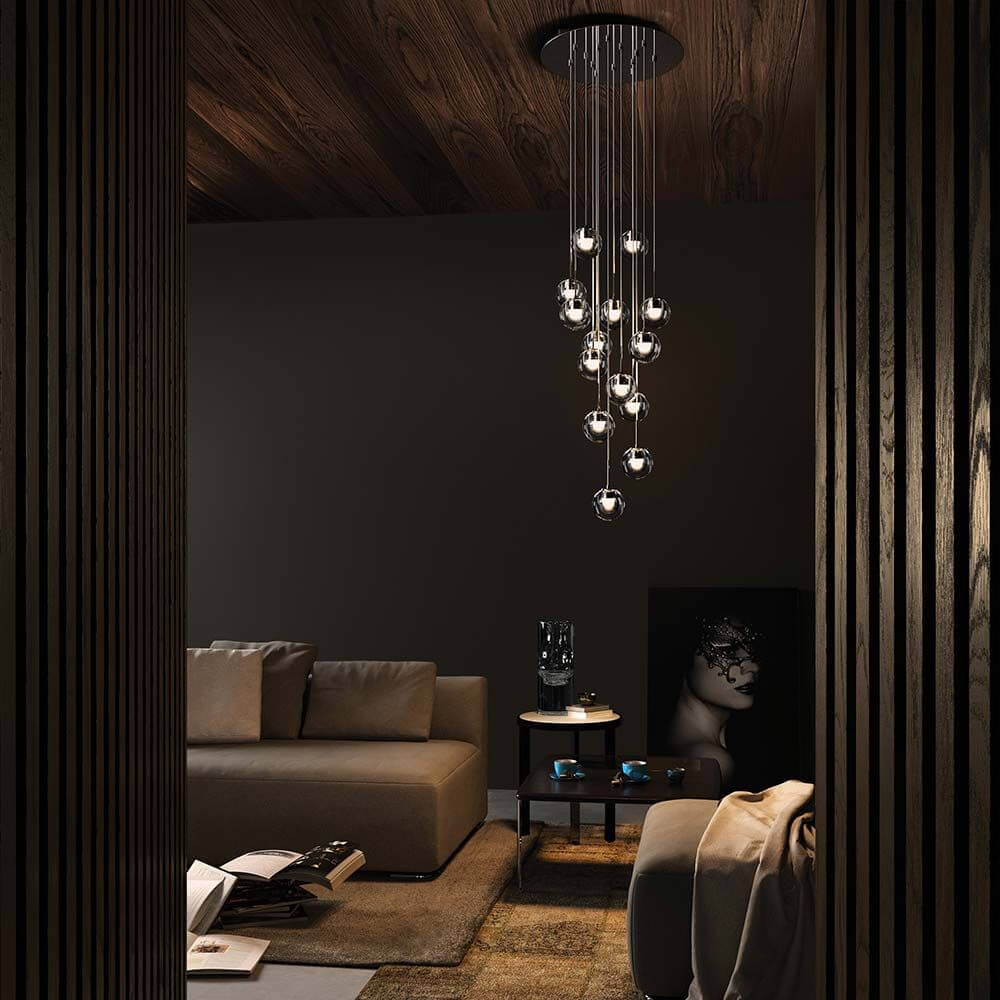 Kundalini LED Pendellampe Dew Ø 11cm Dimmbar in elegantem Wohnambiente mit stilvollem Sofa und Dekoration.
