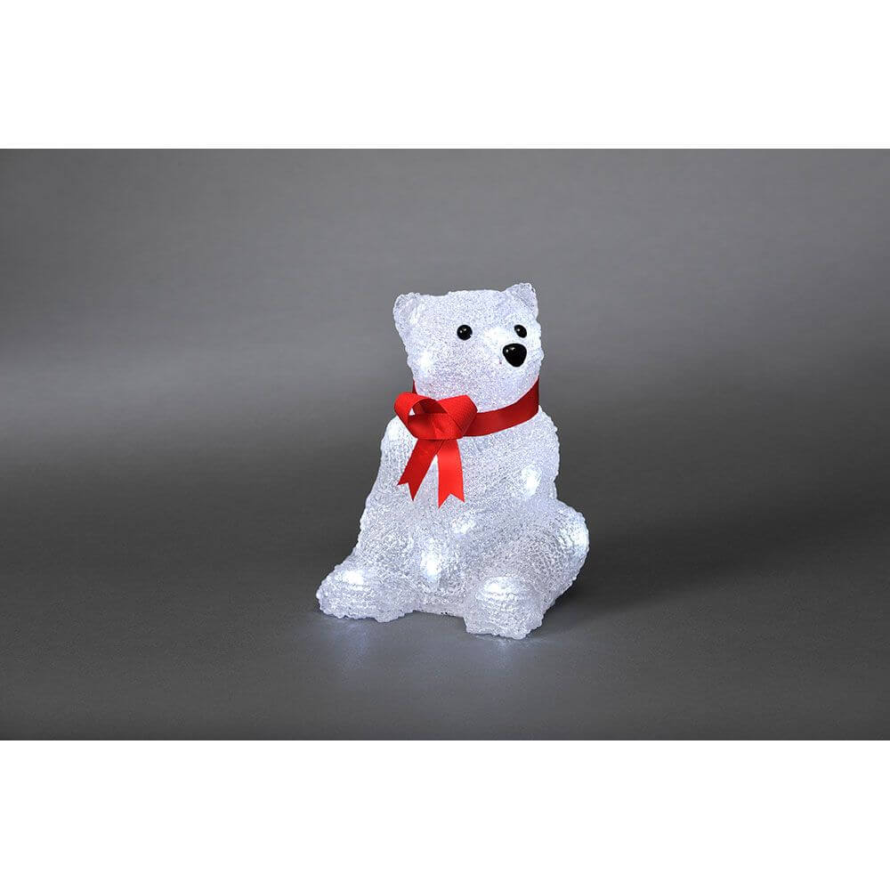 LED Acryl Eisbär mit roter Schleife 16 Kaltweiße Dioden auf grauem Hintergrund