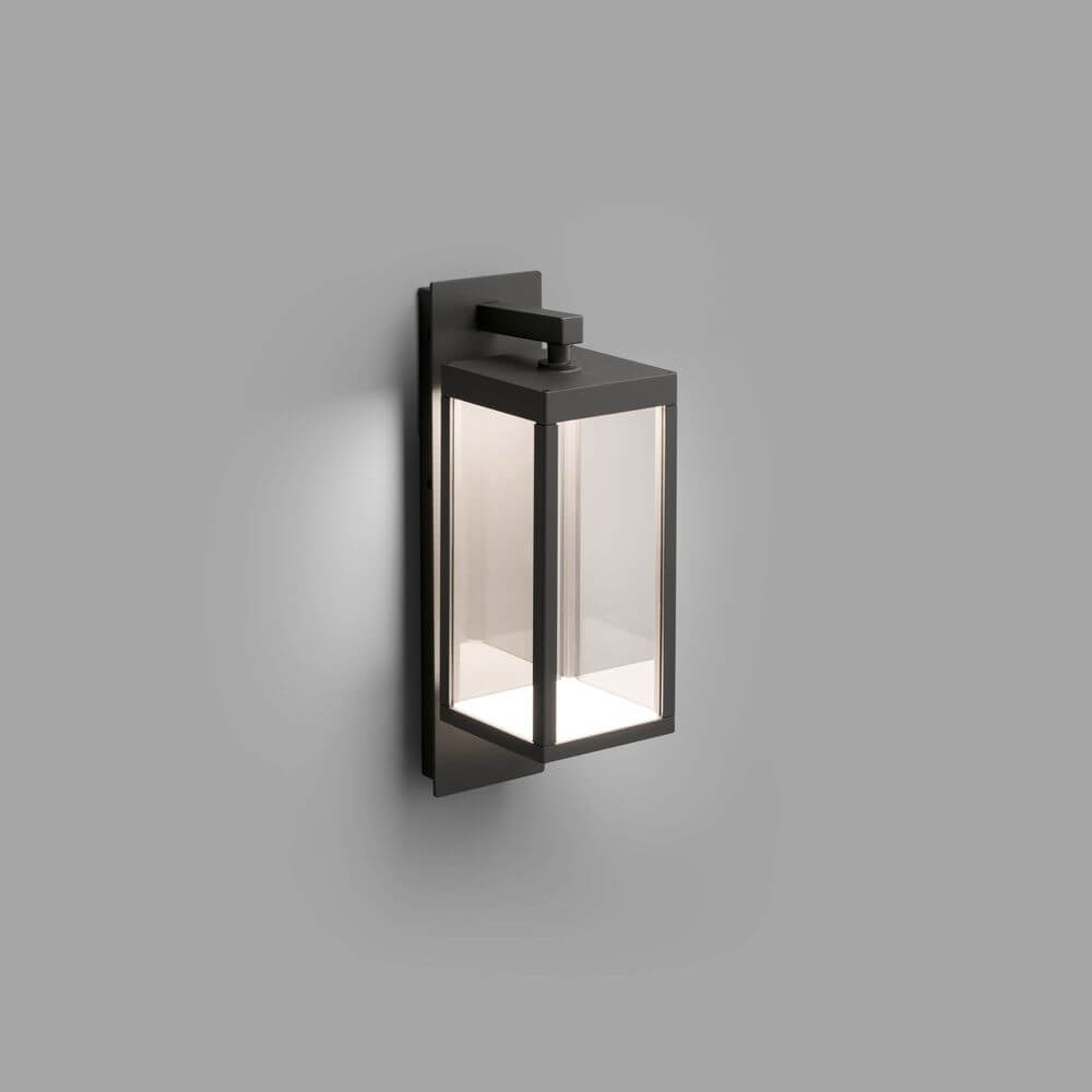 LED Außenwandleuchte KERALA IP54 Dunkelgrau an Wand montiert, modernes Design mit klaren Glaselementen.