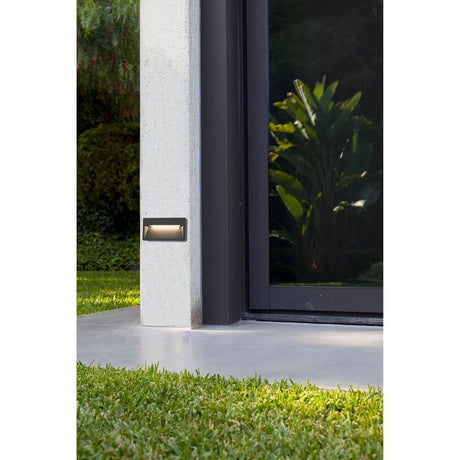 LED Outdoor surface-mounted light PATH 3000K IP44 Dark grey installed at an outdoor entrance.