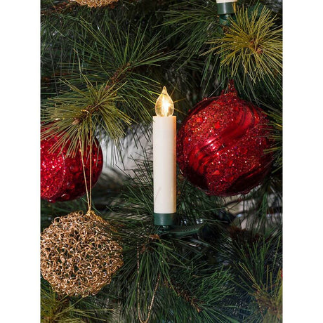 LED Tree lighting 10 wireless white candles remote control warm white battery-operated on a Christmas tree.