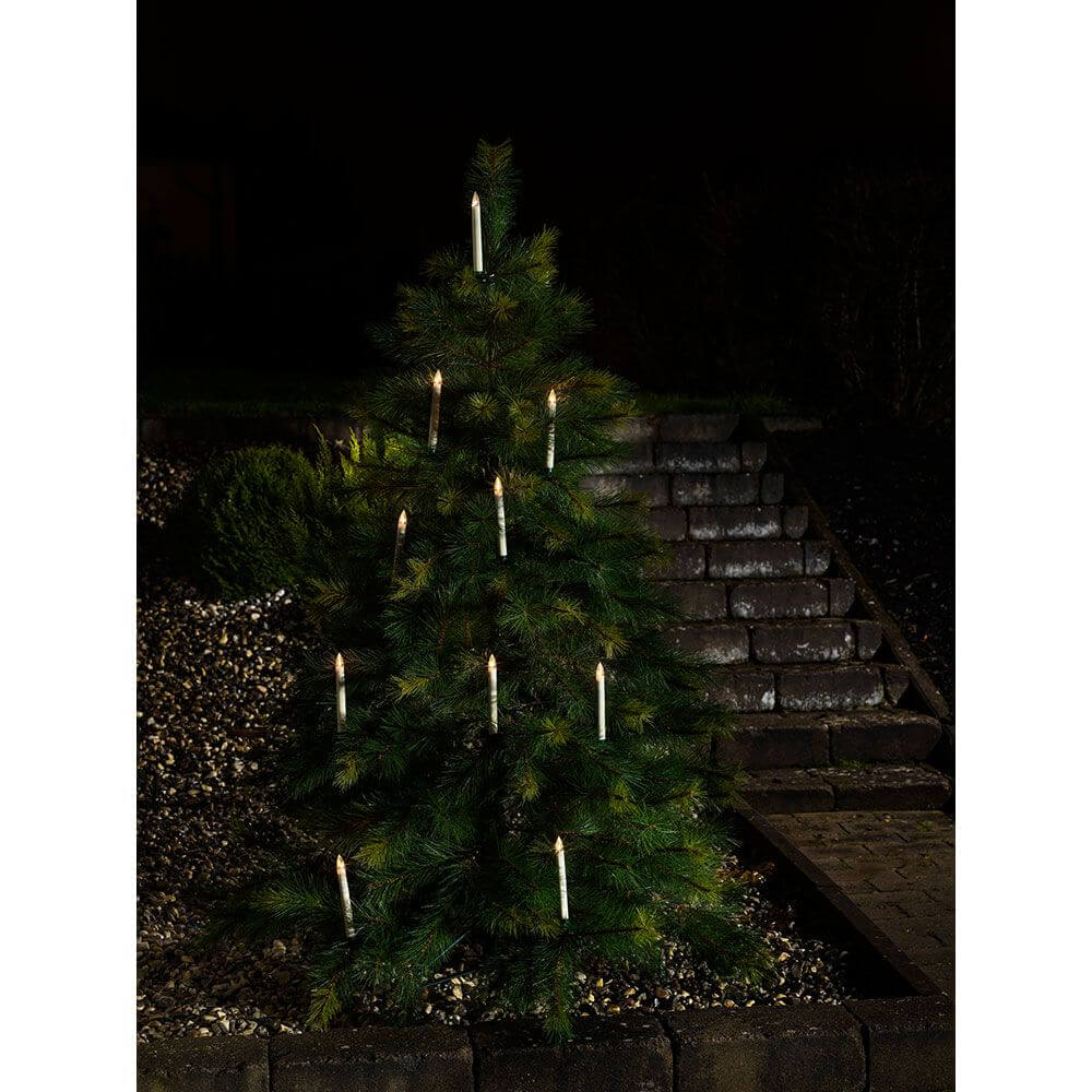 5 LED Kerzen Zusatzset für 1930-100 5 Warmweiß IP44 an einem geschmückten Weihnachtsbaum bei Nacht.
