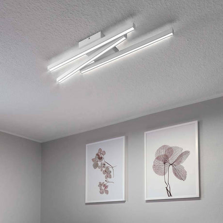 LED Linus Sidelong ceiling light 2520lm white in a modern room with decorative pictures on the wall.