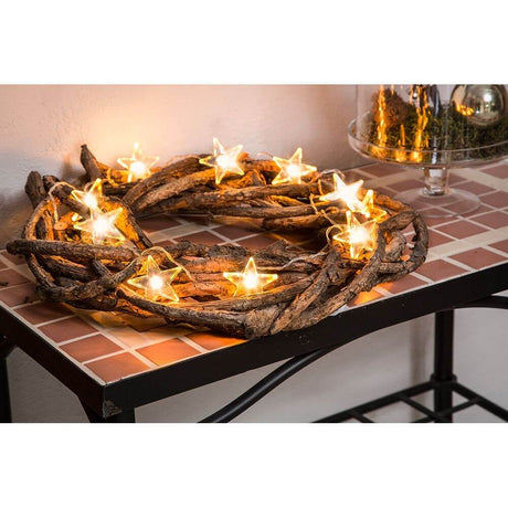 LED Decorative string lights clear stars 10 warm white diodes battery-operated on a decorative wooden wreath.