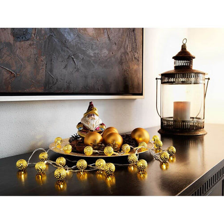 LED Decorative light chain with small gold-coloured metal balls, 20 warm white LEDs, battery-powered, decorated on a table.