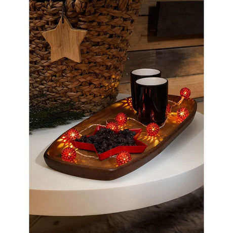 LED decorative string lights small red metal balls 10 warm white diodes battery-operated on a decorative tray.