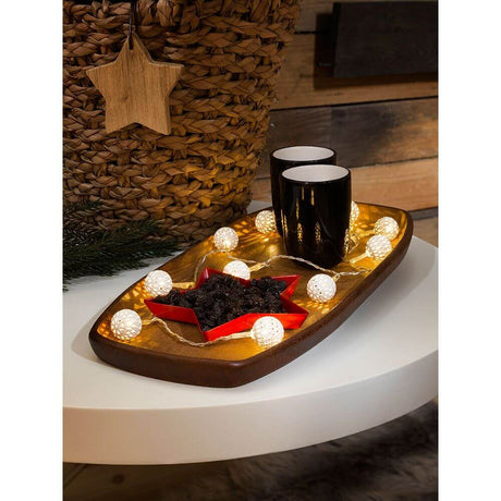 LED Decorative light chain with small white metal balls, 10 warm white diodes, battery-operated, in a festive arrangement.