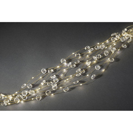 LED Diamond tinsel 24 strands with 20 diodes 480 warm white diodes gold-colored wire on a dark background