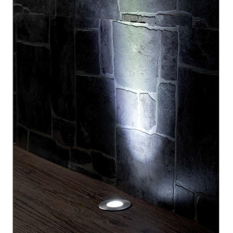 LED CURTIS recessed light IP44 matt nickel, asymmetrical, shines on a stone wall.
