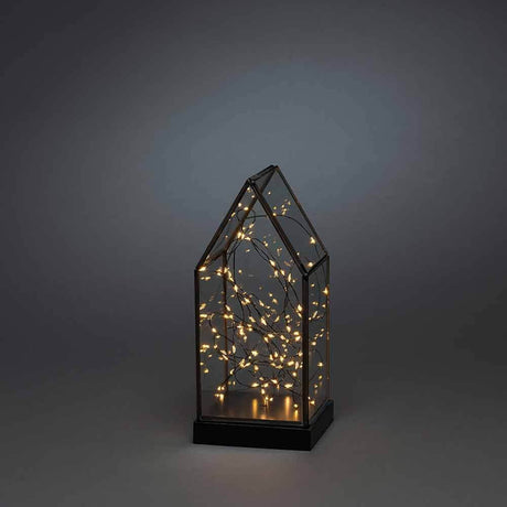LED Glaslaterne mit schwarzem Holzfundament und 6h Timer Schwarz auf einem dunklen Hintergrund