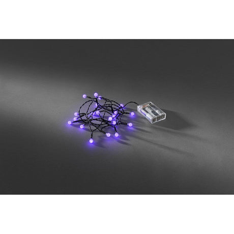 LED Globe string lights with round diodes, timer, 20 purple diodes, battery-operated on a black background.