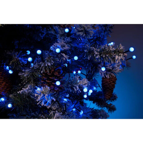 LED Globe string lights round diodes 80 blue diodes IP44 decorated a snow-covered Christmas tree.