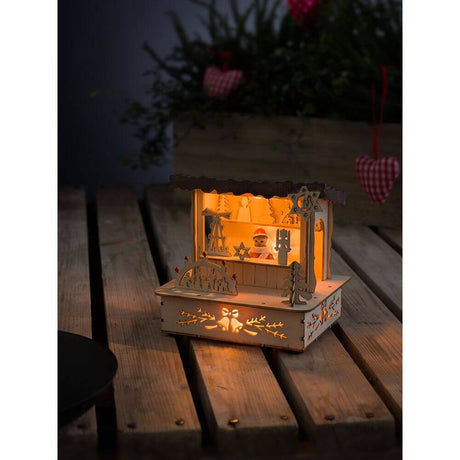 LED Holzsilhouette naturfarben Marktstand mit braunem Dach 3 Warmweiße Dioden batteriebetrieben auf Holzoberfläche.