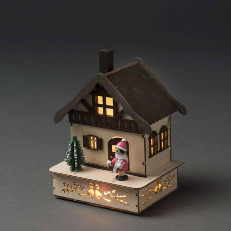LED Holzsilhouette Fachwerkhaus Weihnachtsbaum und pinker Figur warmweiß batteriebetrieb mit Beleuchtung.