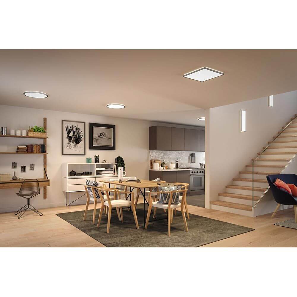 LED Panel Decken- & Wandleuchte Atria Shine in 3 Stufen-Dimmbar installiert in modernem Wohnbereich mit Esstisch.
