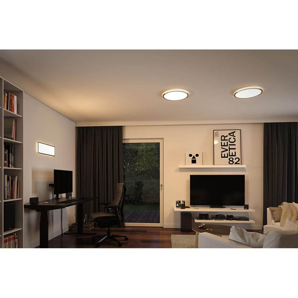 LED Panel Atria Shine Rund RGBW Dimmbar in modernem Wohnzimmer mit dimmbarer Beleuchtung.