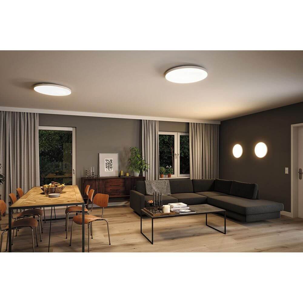 LED Panel Smart Home Zigbee Velora CCT Rund 40cm Weiß in modernem Wohnzimmer mit gemütlicher Beleuchtung.
