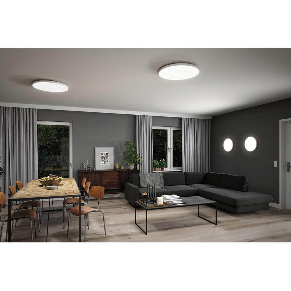 LED Panel Smart Home Zigbee Velora CCT Rund 40cm Weiß in einem modernen Wohnraum mit eleganter Einrichtung.