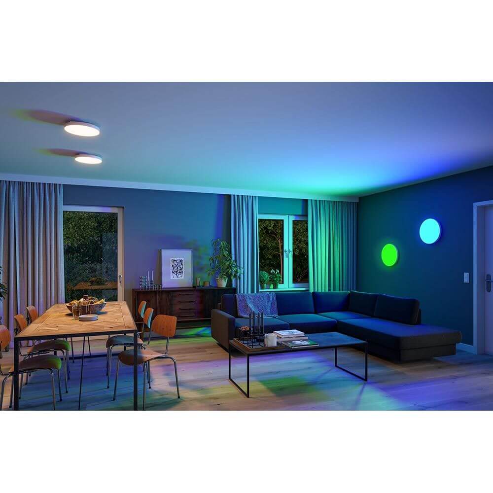 LED Panel Smart Home Zigbee Velora Rund RGBW in modernem Wohnzimmer mit sanfter Beleuchtung.