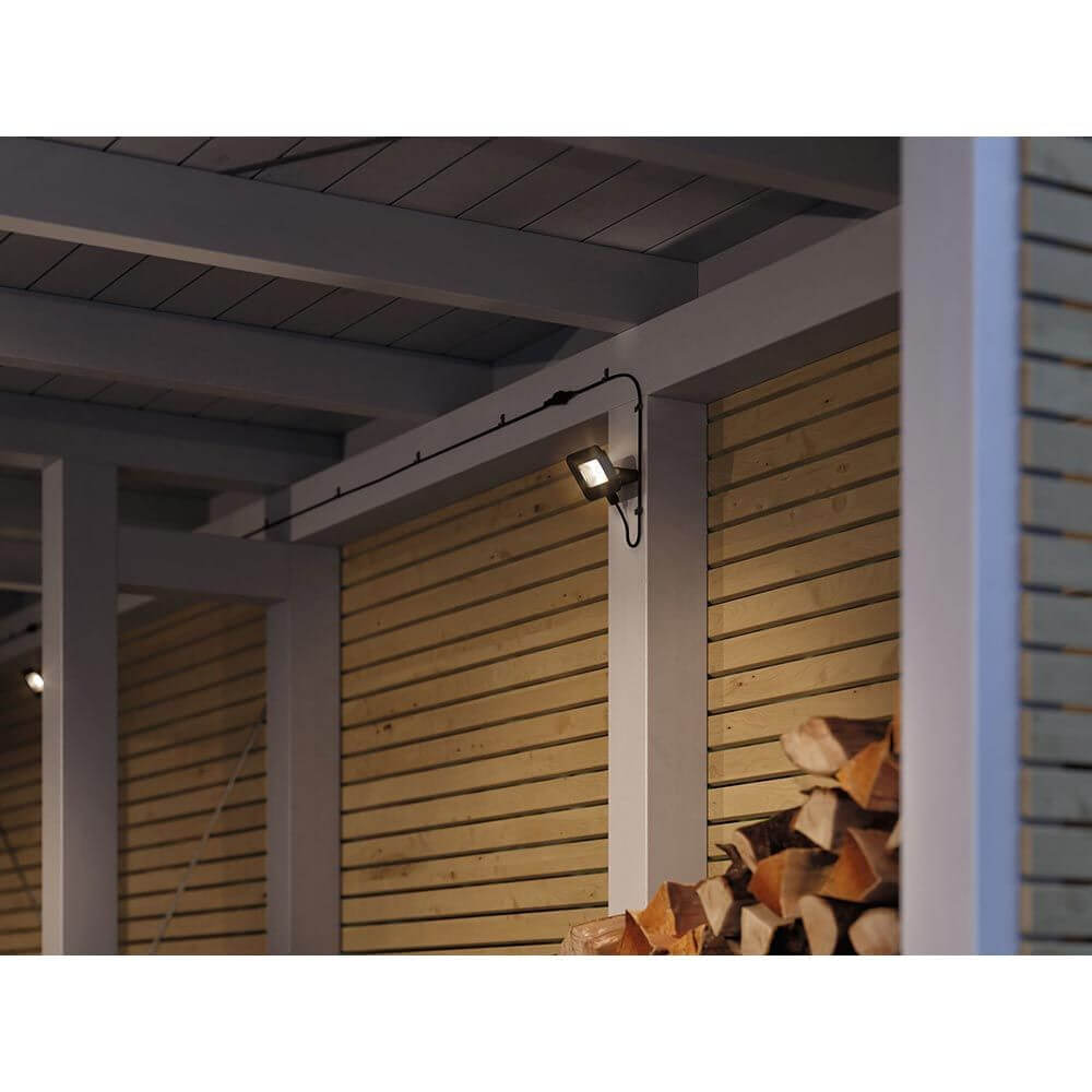 Park + Light LED Außen-Wandstrahler Bimea IP65 Schwarz an einer Wand im Außenbereich.