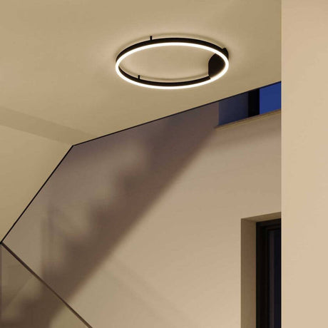 s.luce LED ring wall lamp & ceiling light dimmable modern round mounted on the ceiling in a modern room.