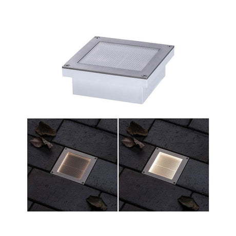 LED Luminaire solaire d’encastrement au sol Aron avec détecteur de mouvement IP67 3000K sous deux angles sur des pavés.