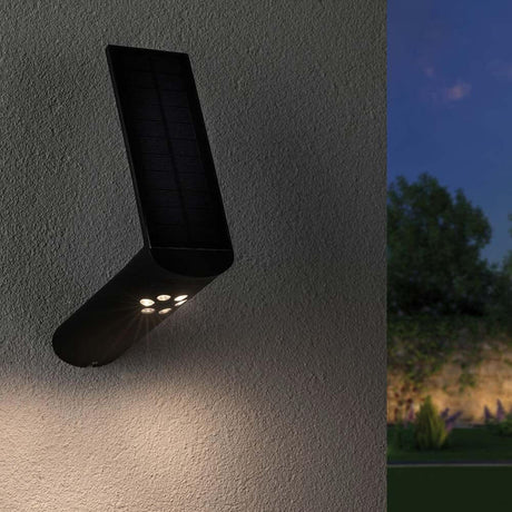 LED Solar-Wandlampe Ilias IP44 3000K Bewegungsmelder Anthrazit an Außenwand montiert.