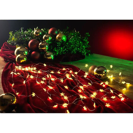 LED Star tinsel, 24 strands with 20 diodes, 480 warm white diodes, decorative lighting with stars on red fabric.
