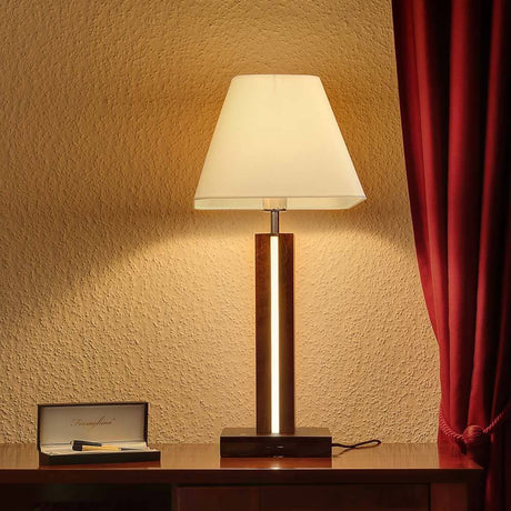 LED Tischlampe Quad 980lm Touch-Dimmer Nussbaum, Weiß, Schwarz auf einem Tisch mit einem Stift und einer Box.
