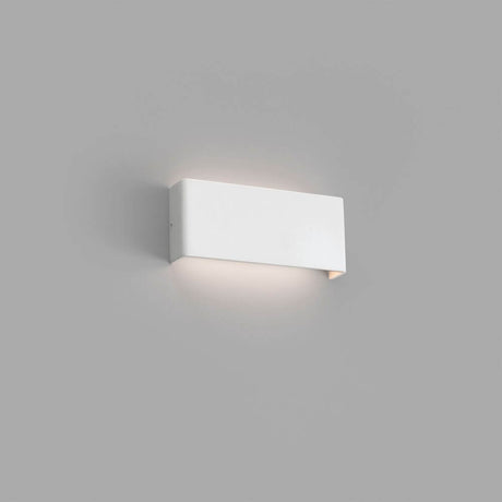 LED Wandlampe NASH 8W Weiß an einer grauen Wand installiert, modern und stilvoll.