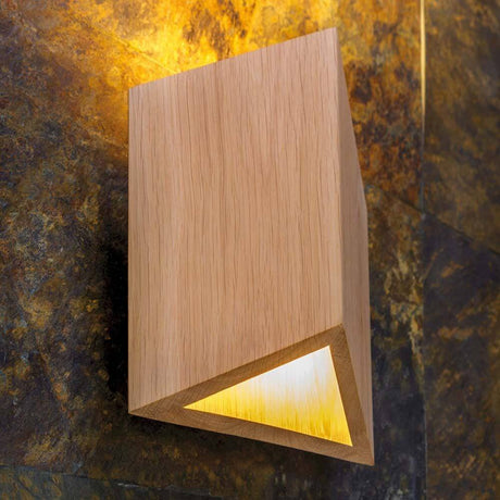 LED Wall light Trekant 720lm oiled oak on a wall, modern and stylish with warm light.