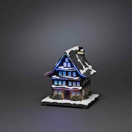LED Battery-operated winter house & 3 multicolored LEDs on a gray background.