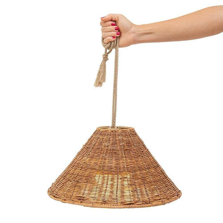 Calobra Natur LED pendant light held in one hand with remote control