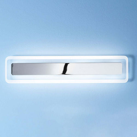 Antille LED-Wandleuchte Large an einer blauen Wand mit modernem Design und sanfter Beleuchtung.