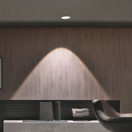 Gypsum Eye LED recessed spotlight 3000K on wood paneling with soft lighting.