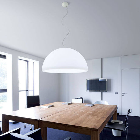 Modern Ohps P pendant light above a table in an elegant office interior.