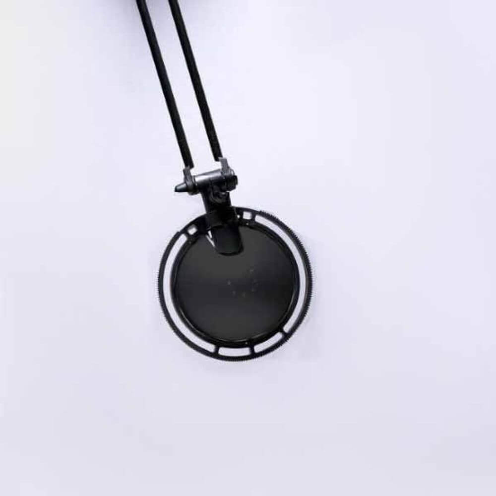 Luceplan Berenice Piccolo Tischlampe mit flexiblem Arm und 360° Leuchtkopf in Schwarz.